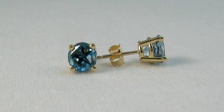 Earrings of Medium dark blue topaz Lone Star cut